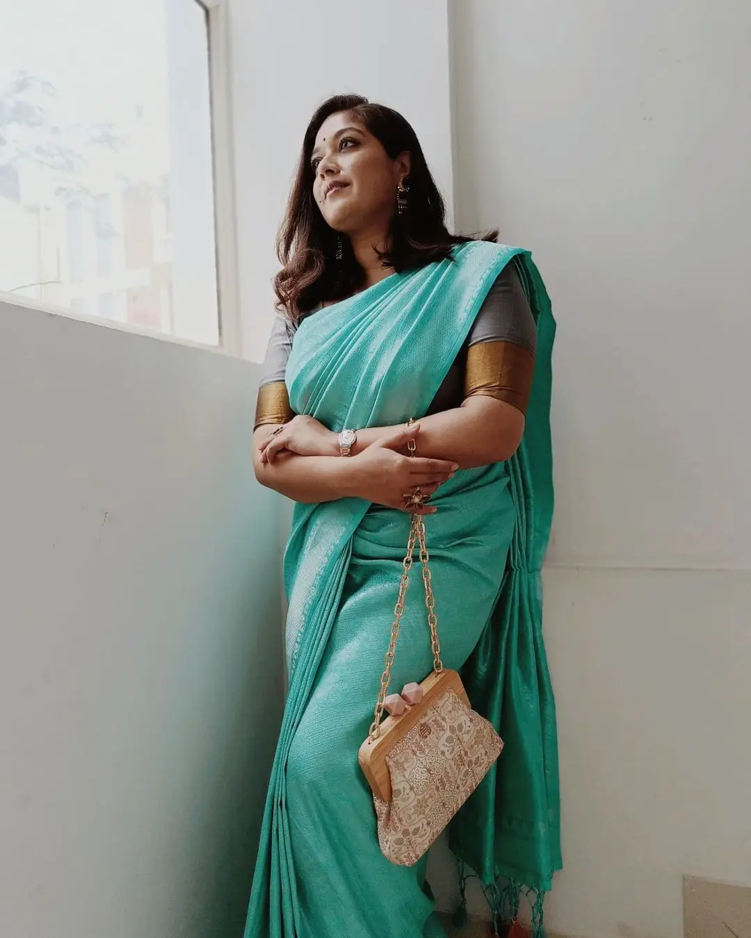 Actress Meghana Raj Wearing Beautiful Earring Blue Saree